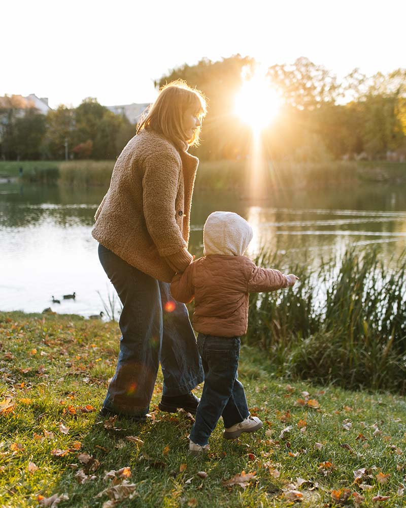 Mother and child by the pond